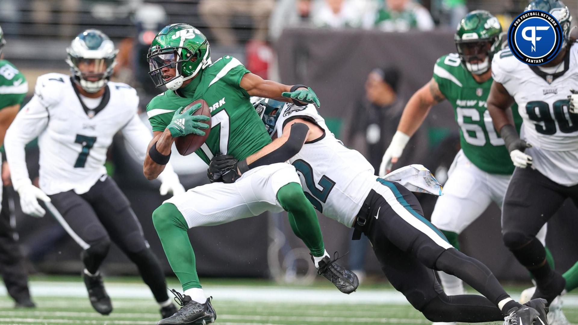 New York Jets wide receiver Garrett Wilson (17) is tackled by Philadelphia Eagles safety Reed Blankenship (32).