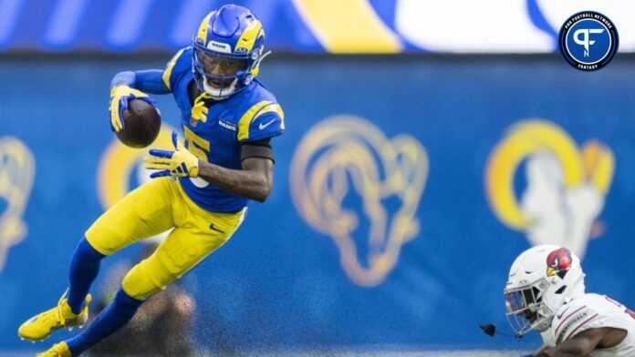 Los Angeles Rams wide receiver Tutu Atwell (5) runs the football against Arizona Cardinals cornerback Kei'Trel Clark (13).