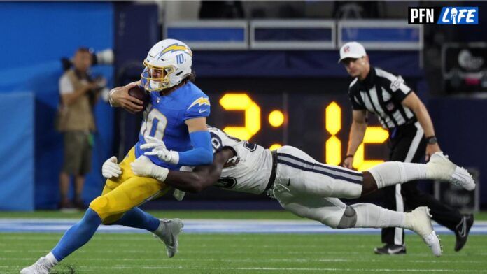 Dallas Cowboys defensive end DeMarcus Lawrence (90) tackles Los Angeles Chargers quarterback Justin Herbert (10).