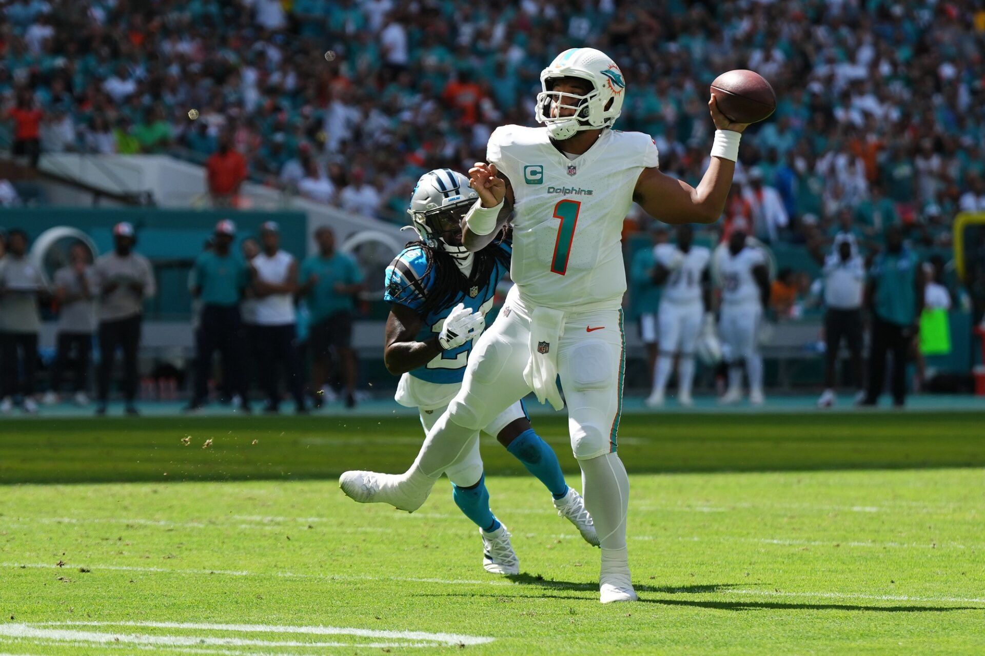 Miami Dolphins QB Tua Tagovailoa (1) throws a pass downfield vs. the Carolina Panthers.