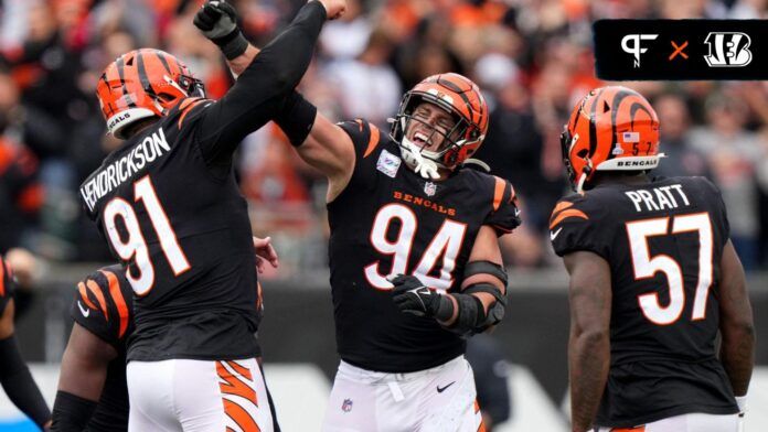 Cincinnati Bengals defensive linemen Trey Hendrickson (91) and Sam Hubbard (94) celebrate a sack.