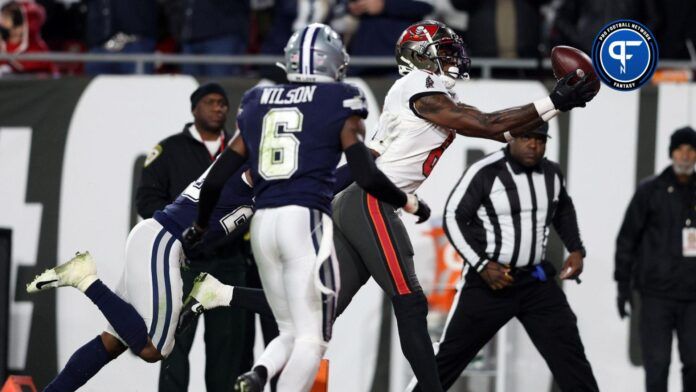 Tampa Bay Buccaneers wide receiver Julio Jones (6) makes a touchdown catch over Dallas Cowboys safety Donovan Wilson (6) in the second half during the wild card game at Raymond James Stadium.