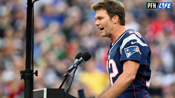 Former New England Patriots QB Tom Brady speaks during a halftime ceremony.