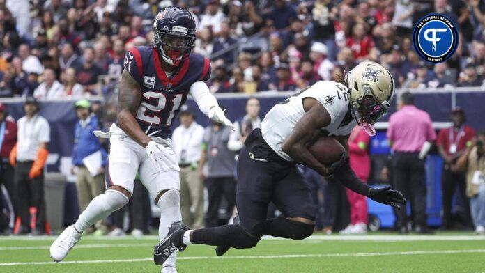 New Orleans Saints wide receiver Rashid Shaheed (22) falls into the end zone for a touchdown as Houston Texans cornerback Steven Nelson (21) defends.