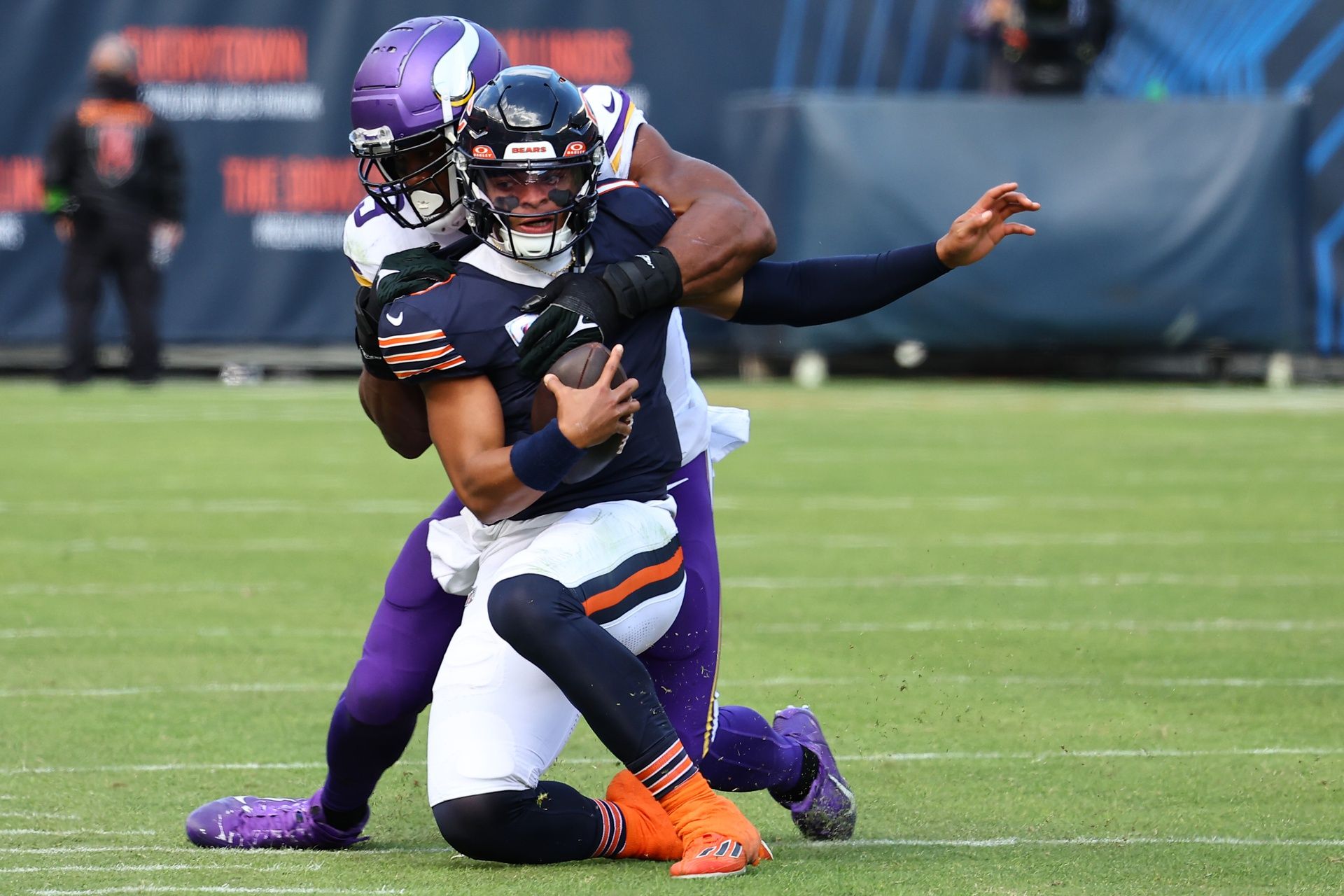 Minnesota Vikings linebacker Danielle Hunter (99) tackles Chicago Bears quarterback Justin Fields (1) during the second half at Soldier Field.