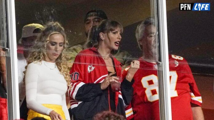 Taylor Swift laughs while talking to Ed Kelce (Travis Kelce s father) during the second half of the game between the Kansas City Chiefs and Denver Broncos at GEHA Field at Arrowhead Stadium.