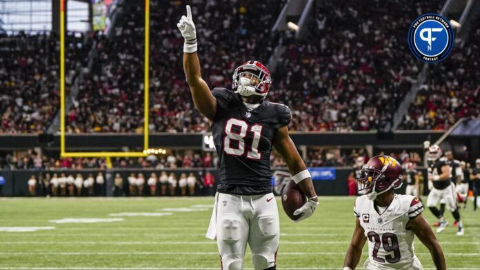 Jonnu Smith (81) reacts after scoring a touchdown past Washington Commanders cornerback Kendall Fuller (29) during the second half at Mercedes-Benz Stadium.