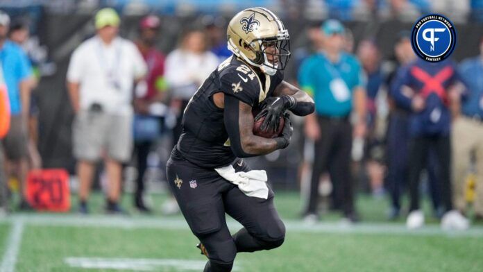 New Orleans Saints running back Jamaal Williams (21) runs against the New Orleans Saints during the first quarter at Bank of America Stadium.