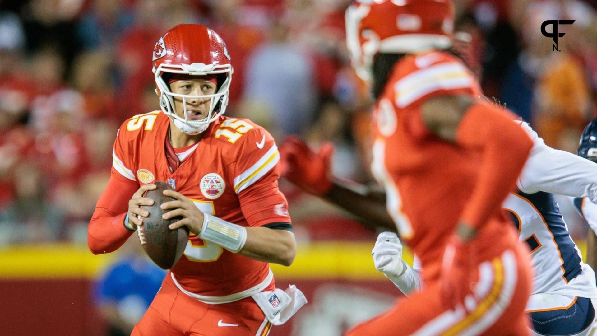 Kansas City Chiefs quarterback Patrick Mahomes (15) scrambles in the backfield during the second quarter against the Denver Broncos.