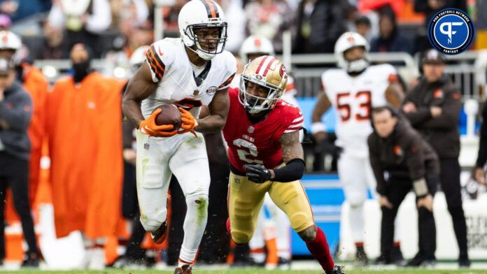 Cleveland Browns wide receiver Amari Cooper (2) runs the ball as San Francisco 49ers cornerback Deommodore Lenoir (2) pulls him down.