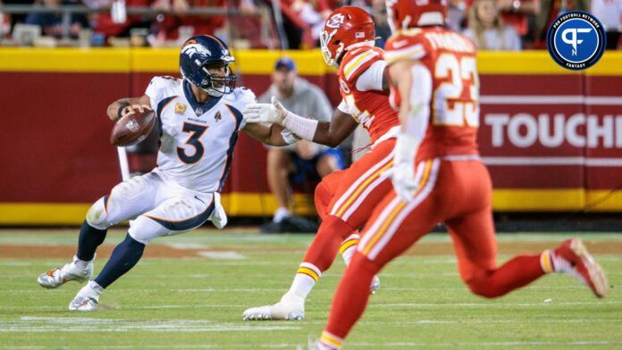 Denver Broncos quarterback Russell Wilson (3) scrambles in the backfield during the fourth quarter against the Kansas City Chiefs.