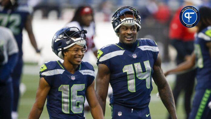 Seattle Seahawks wide receiver Tyler Lockett (16) and wide receiver DK Metcalf (14) return to the locker room following a 37-27 victory against the San Francisco 49ers at CenturyLink Field.