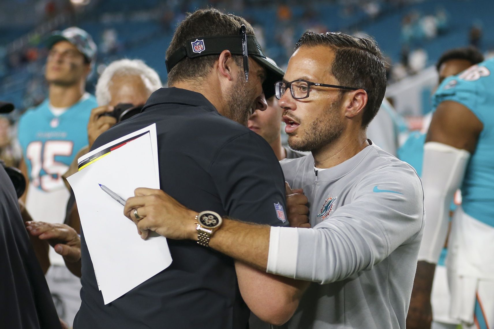 Miami Dolphins head coach Mike McDaniel and Philadelphia Eagles head coach Nick Sirianni talk on the field after the game at Hard Rock Stadium.