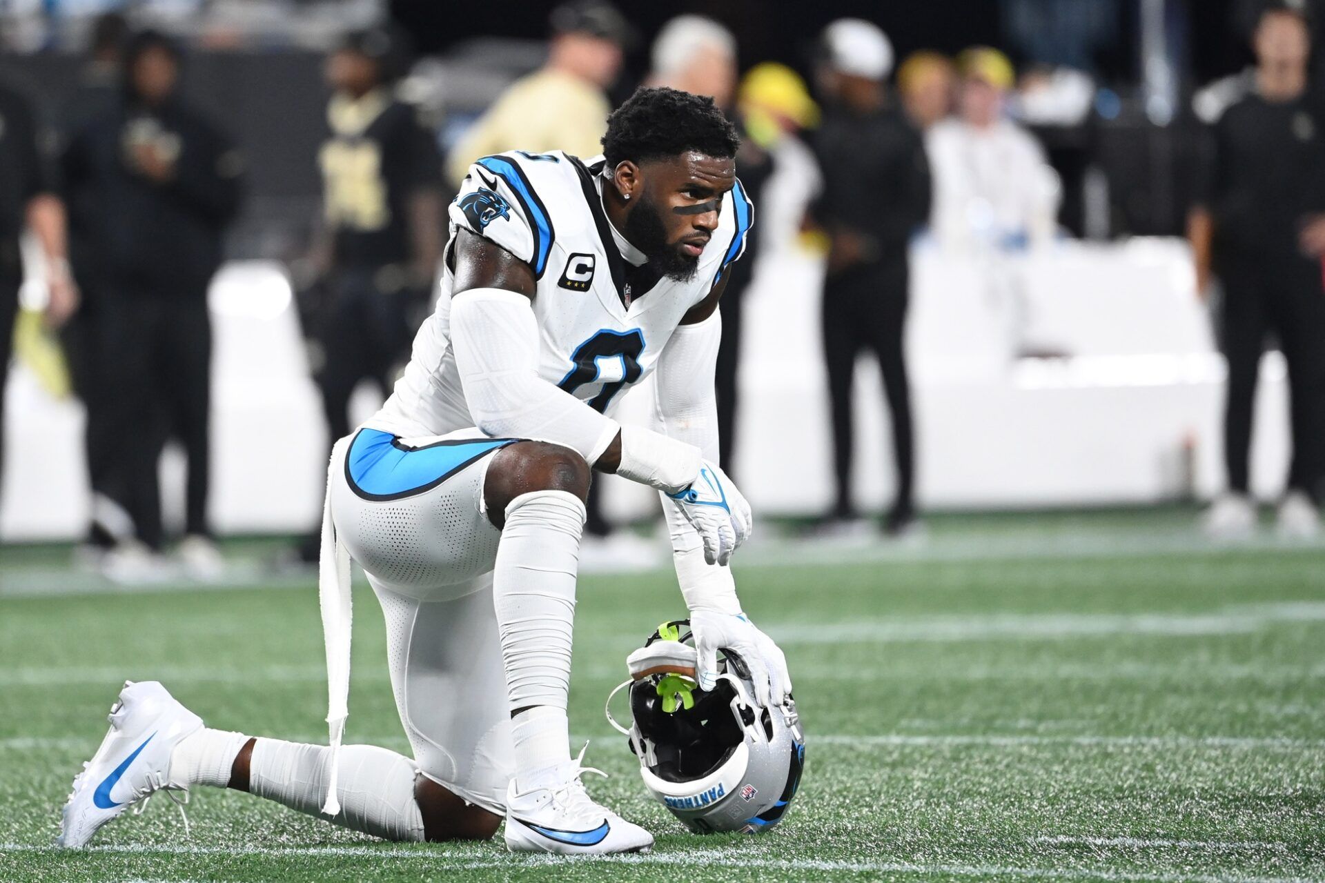 Carolina Panthers LB Brian Burns (0) takes a knee on the field.