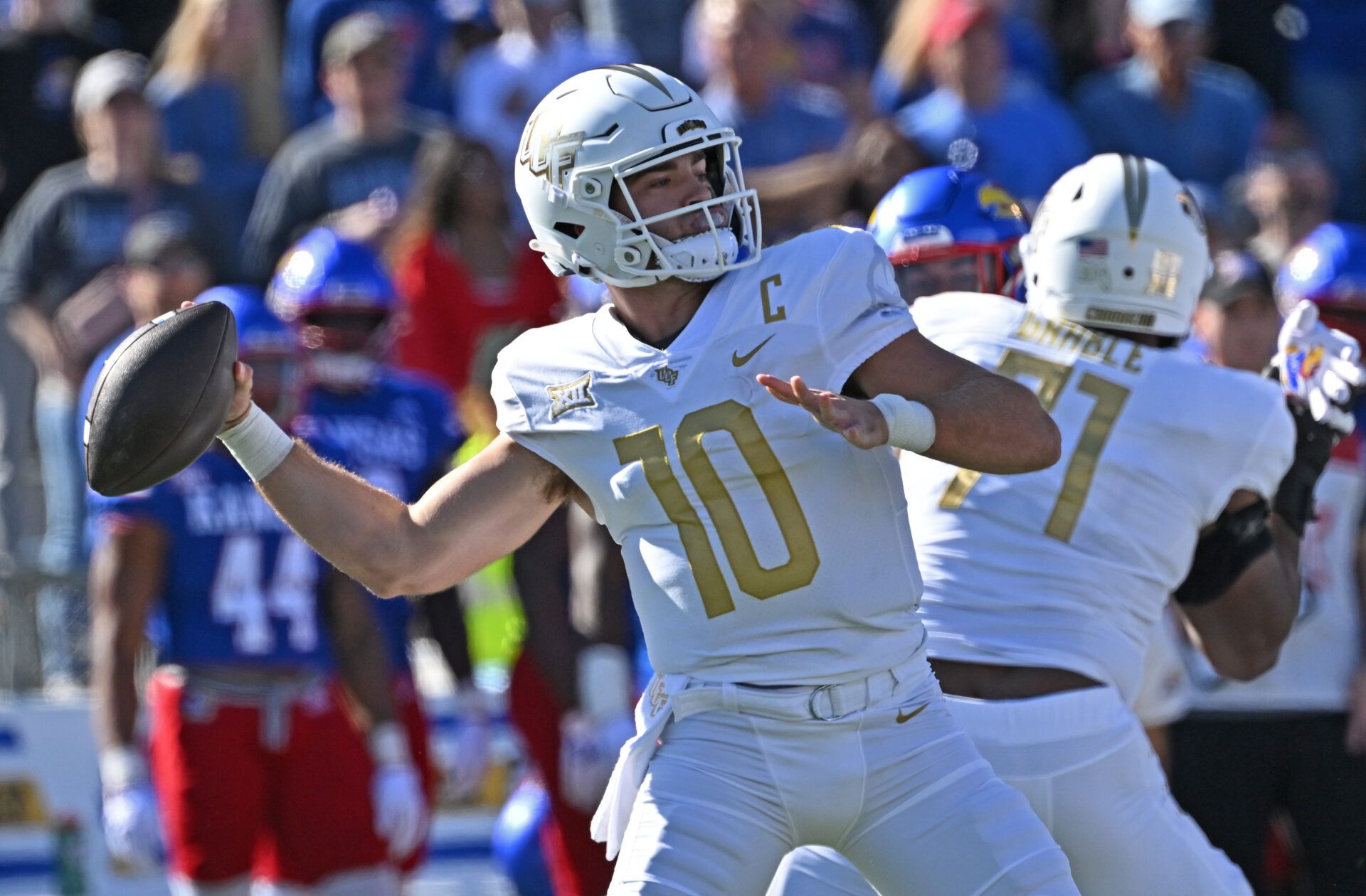 UCF Knights quarterback John Rhys Plumlee (10) throws a pass during the first half against the Kansas Jayhawks at David Booth Kansas Memorial Stadium.