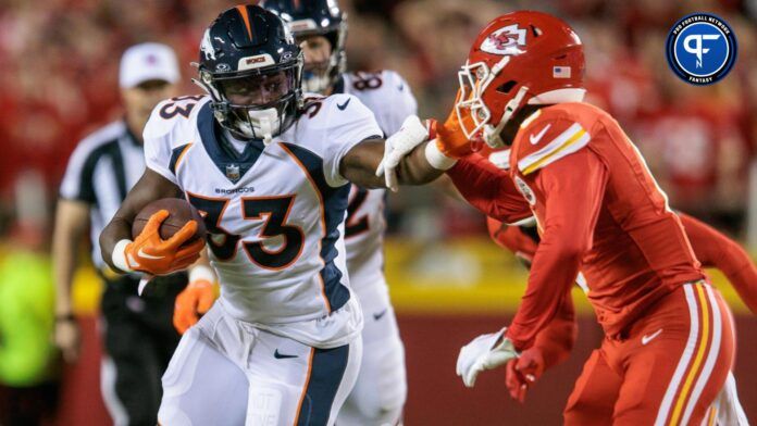 Javonte Williams (33) runs the ball during the first quarter against the Kansas City Chiefs at GEHA Field at Arrowhead Stadium.