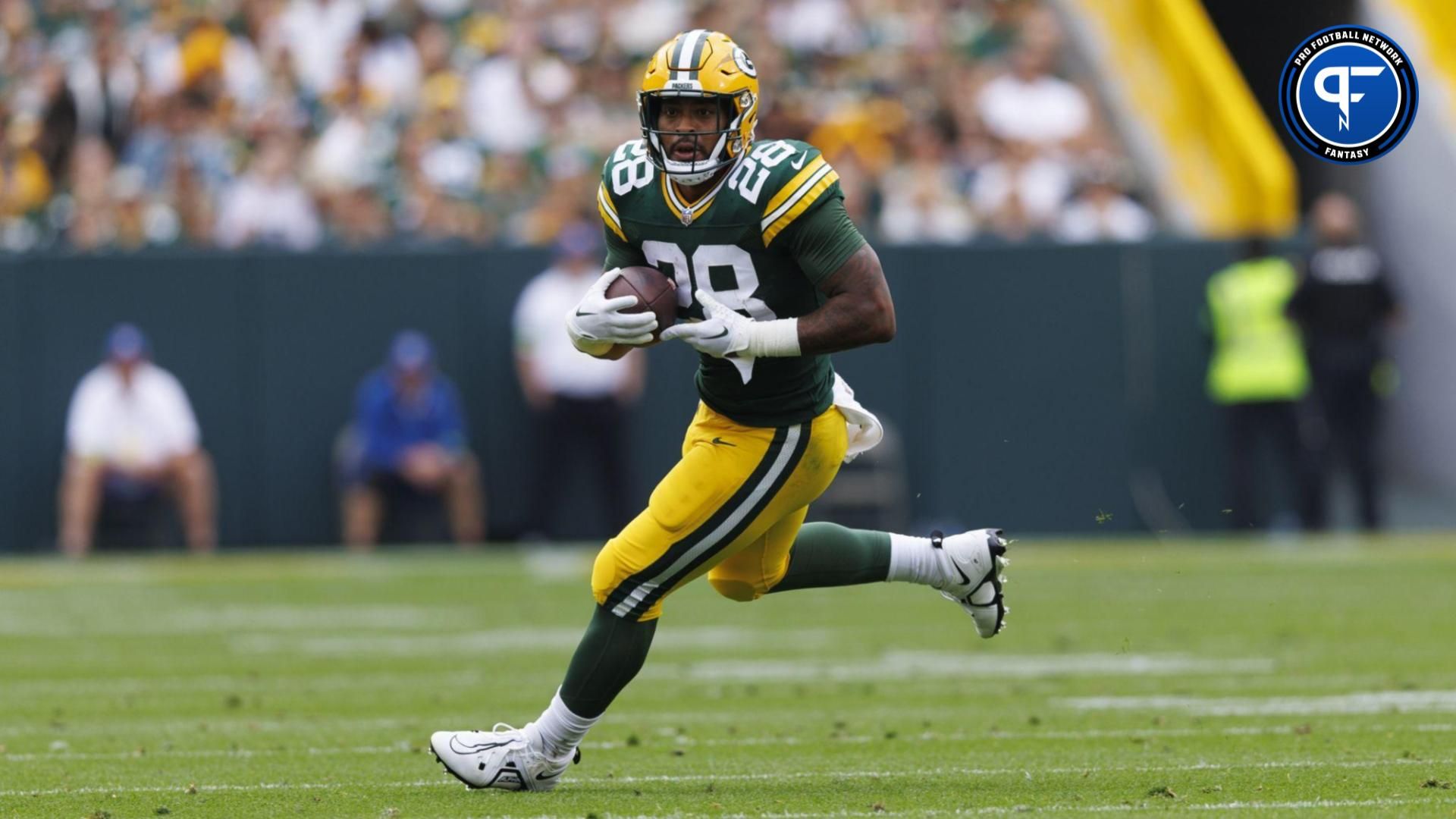 AJ Dillon (28) rushes with the football during the second quarter against the New Orleans Saints at Lambeau Field.