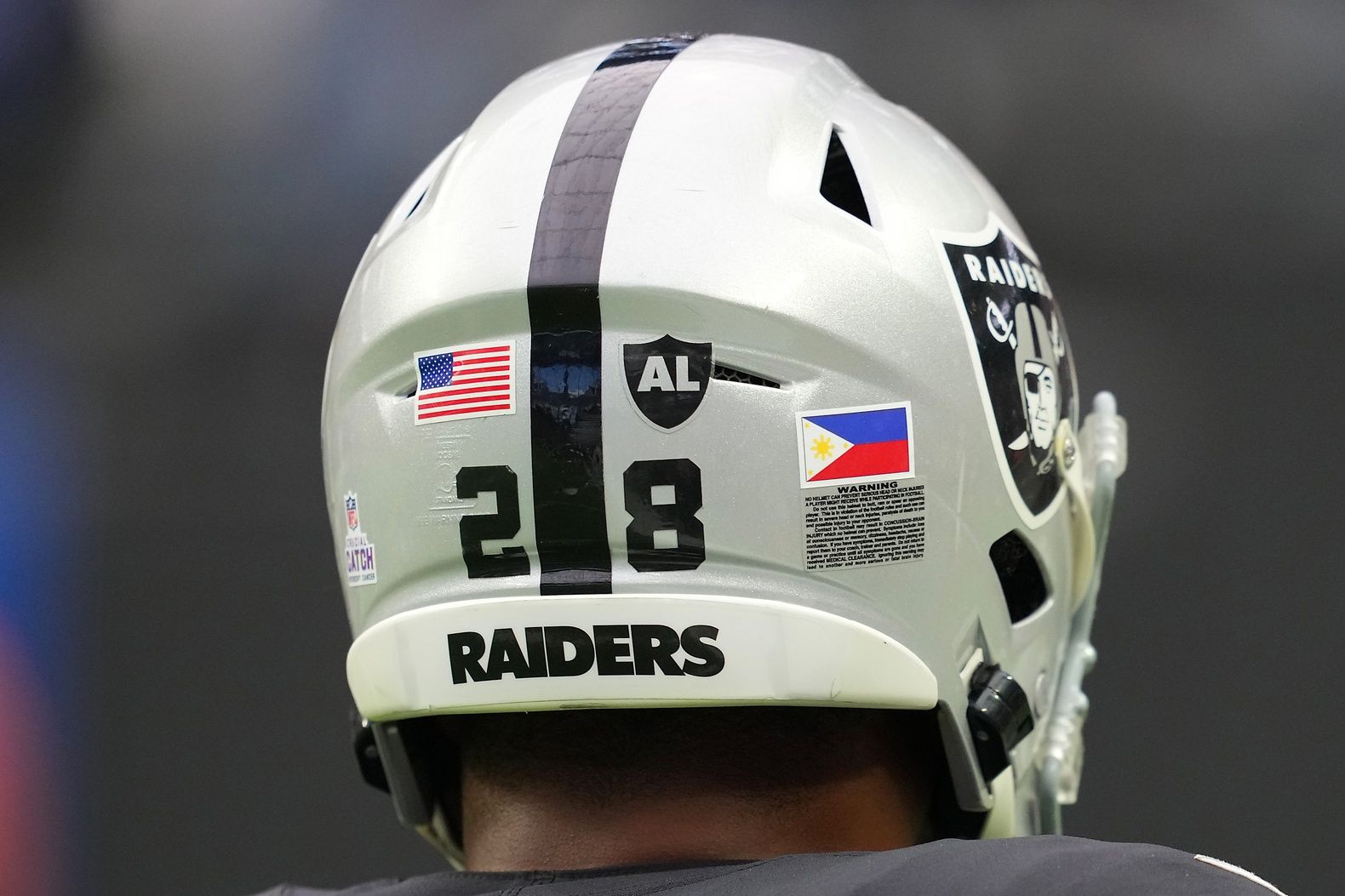 Las Vegas Raiders RB Josh Jacobs (28) displays a decal of the Philippines national flag on his helmet.