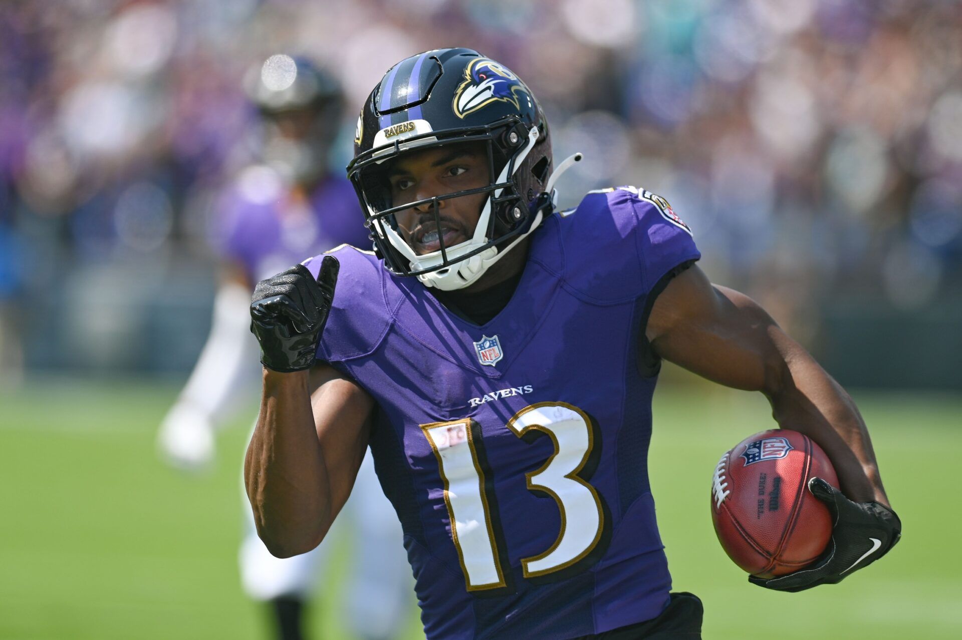 Devin Duvernay (13) returns the opening kick-off for a touchdown during the first quarter against the Miami Dolphins at M&T Bank Stadium.