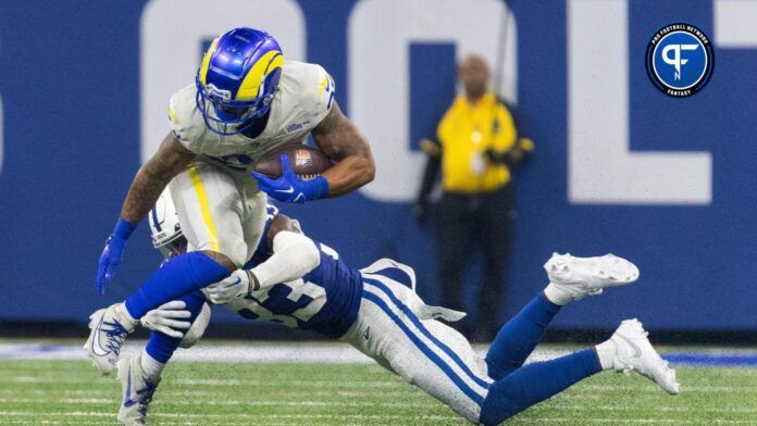 Los Angeles Rams RB Kyren Williams (23) gets tackled by an Indianapolis Colts player.