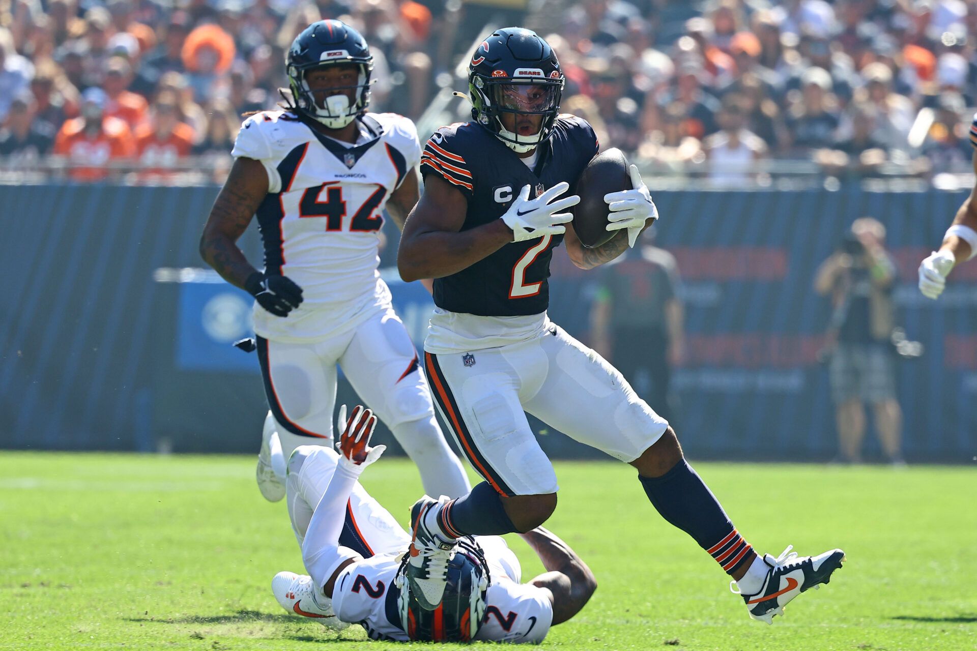 Chicago Bears wide receiver DJ Moore (2) makes a catch against Denver Broncos cornerback Pat Surtain II (2) during the first half at Soldier Field.