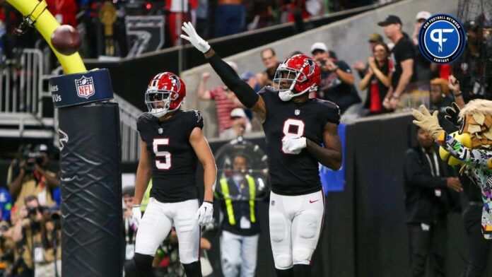 Atlanta Falcons tight end Kyle Pitts (8) celebrates after a touchdown catch against the Washington Commanders in the first quarter at Mercedes-Benz Stadium.