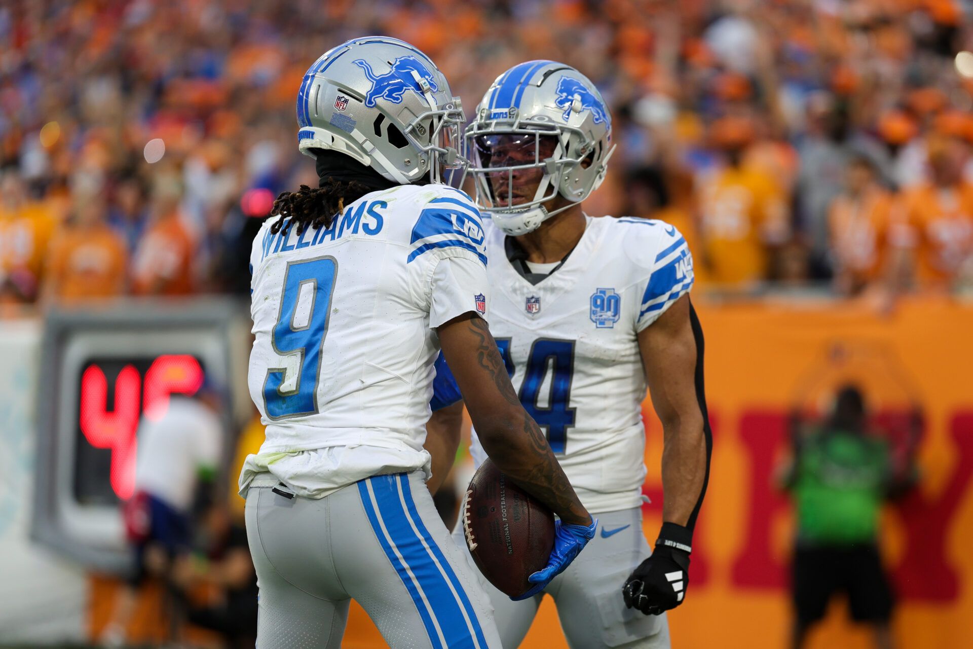 Detroit Lions wide receiver Jameson Williams (9) is congratulate by wide receiver Amon-Ra St. Brown (14) after scoring a touchdown against the Tampa Bay Buccaneers in the third quarter in the third quarter at Raymond James Stadium.
