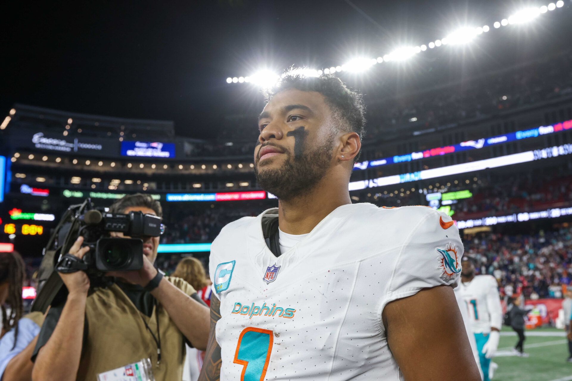 Miami Dolphins quarterback Tua Tagovailoa (1) reacts after defeating the New England Patriots at Gillette Stadium.