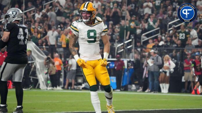 Christian Watson (9) reacts after a 77-yard reception in the second half against the Las Vegas Raiders at Allegiant Stadium.