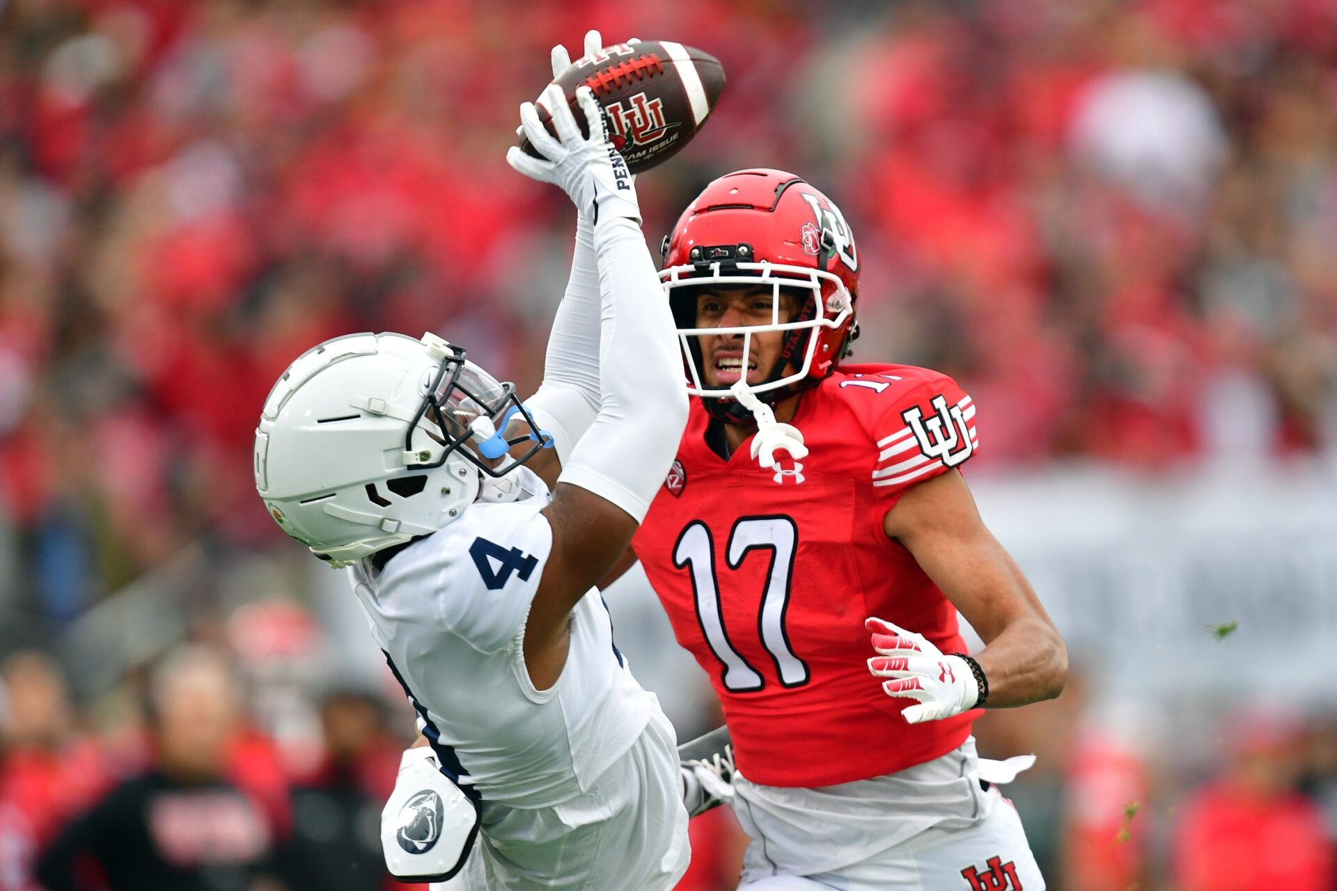 Penn State Nittany Lions cornerback Kalen King (4) intercepts a pass intended for Utah Utes wide receiver Devaughn Vele (17) in the first quarter in the 109th Rose Bowl game at the Rose Bowl.