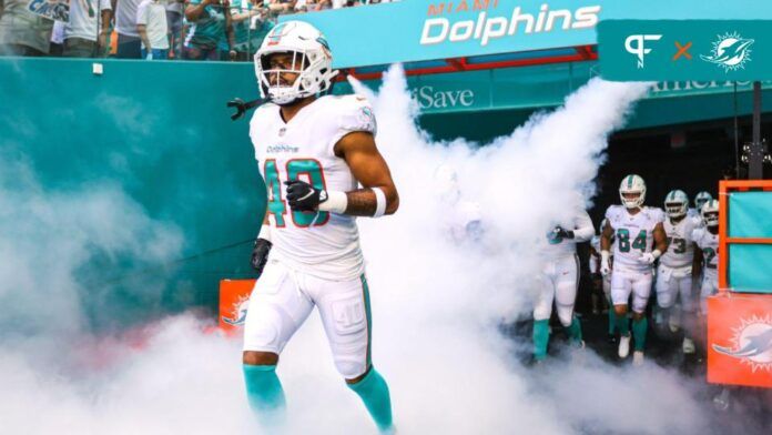 Nik Needham (40) takes on the filed prior the game against the Carolina Panthers at Hard Rock Stadium.