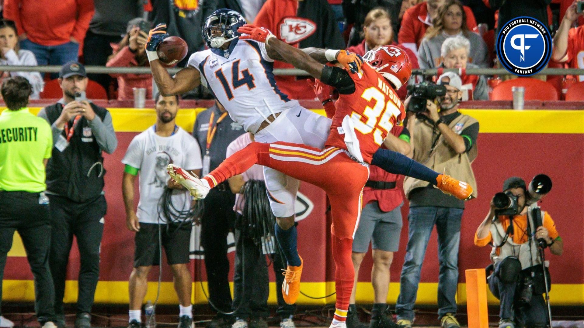 Denver Broncos wide receiver Courtland Sutton (14) goes up for a reception in the end zone around Kansas City Chiefs cornerback Jaylen Watson (35) during the fourth quarter at GEHA Field at Arrowhead Stadium.