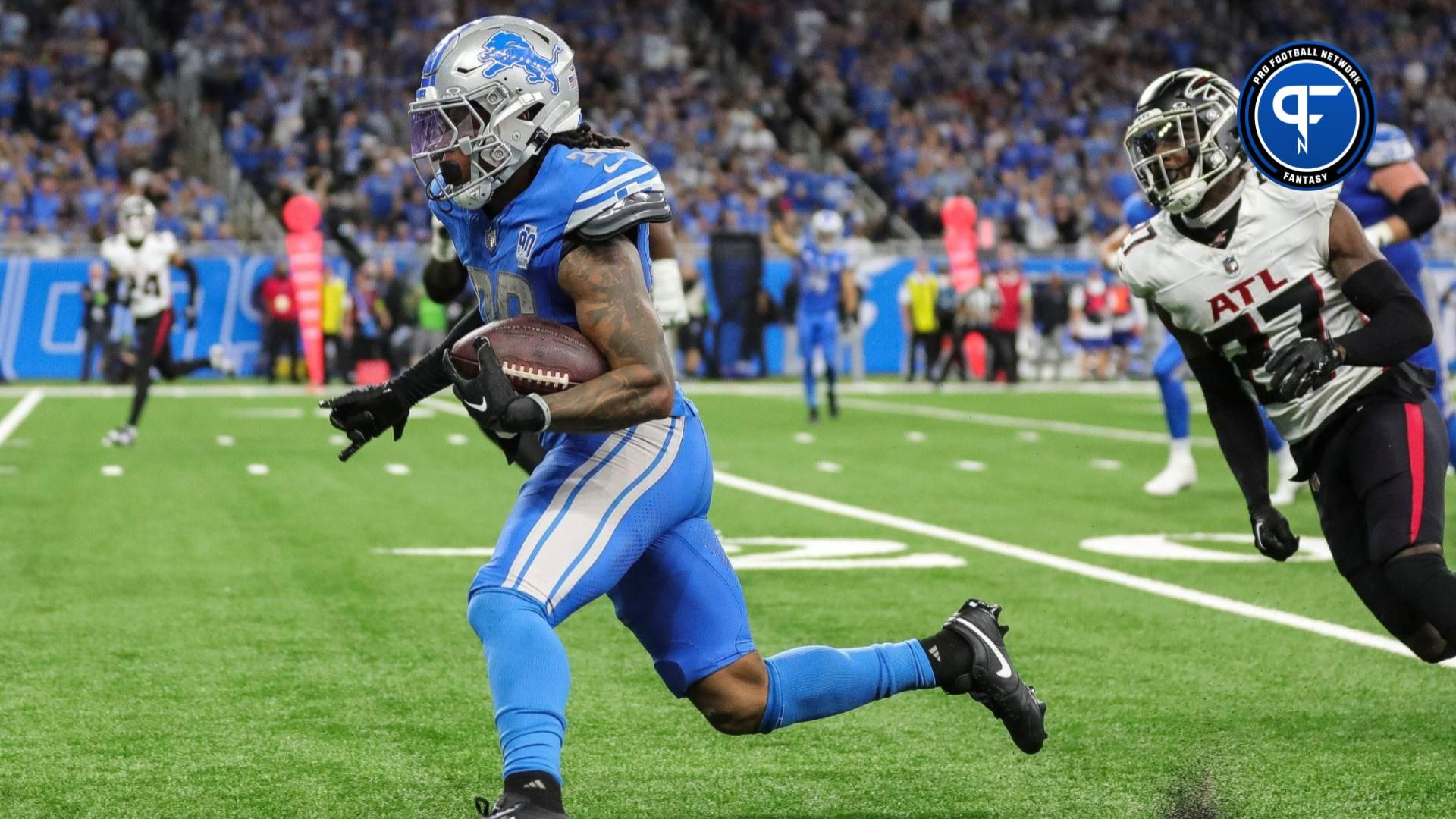 Detroit Lions running back Jahmyr Gibbs (26) runs against Atlanta Falcons during the second half at Ford Field.