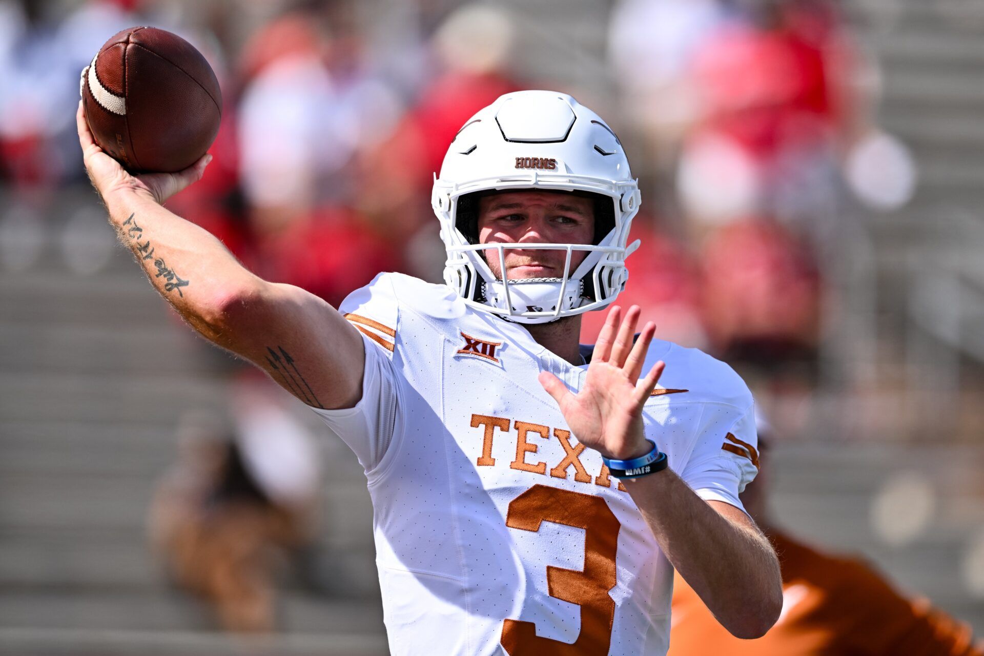 Quinn Ewers (3) warms up prior to the game against the Houston Cougars at TDECU Stadium.