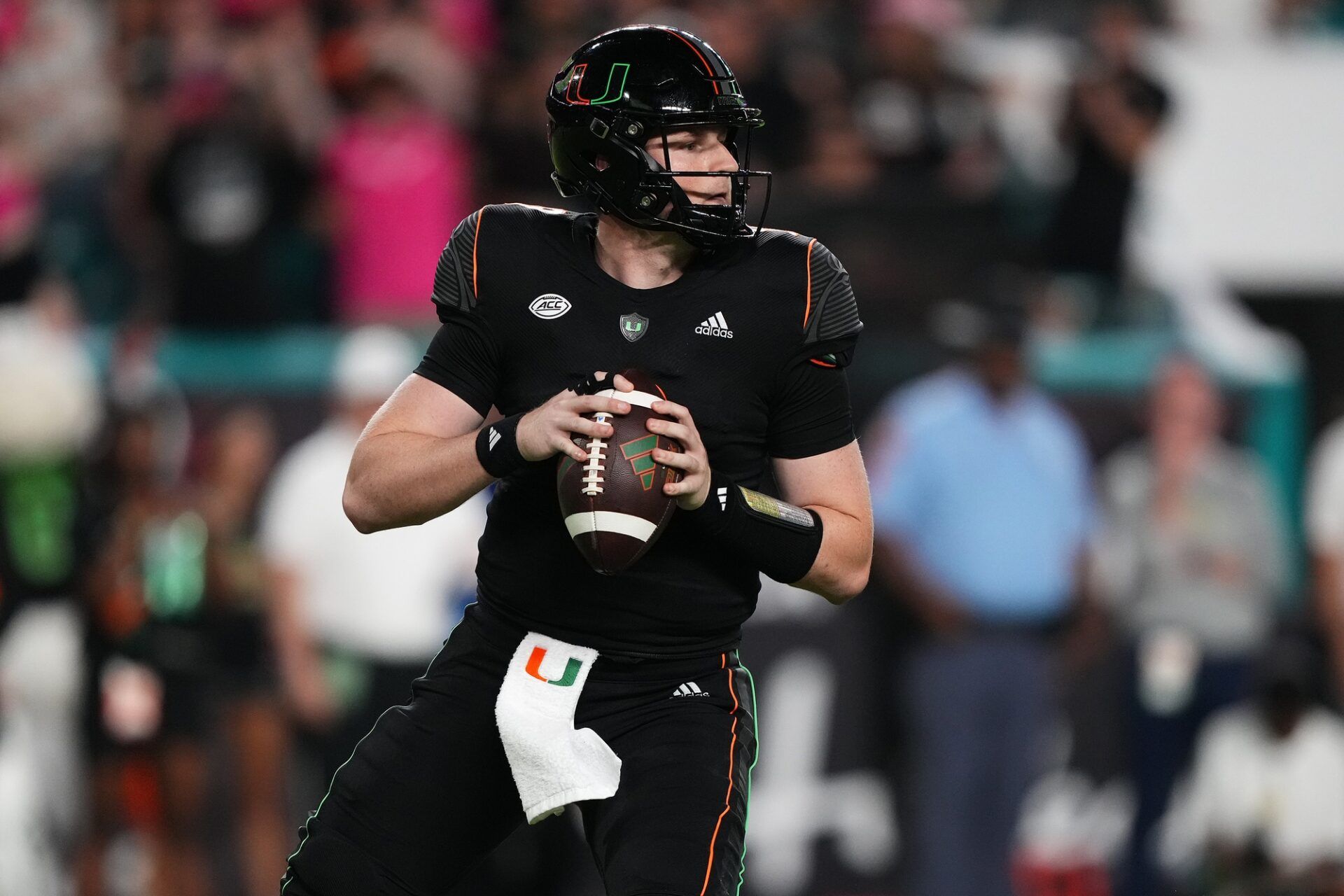 Tyler Van Dyke (9) attempts a pass against the Georgia Tech Yellow Jackets in the second half at Hard Rock Stadium.