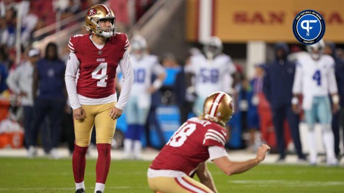 San Francisco 49ers place kicker Jake Moody (4) prepares to kick an extra point with punter Mitch Wishnowsky (18) against the Dallas Cowboys during the fourth quarter at Levi's Stadium.