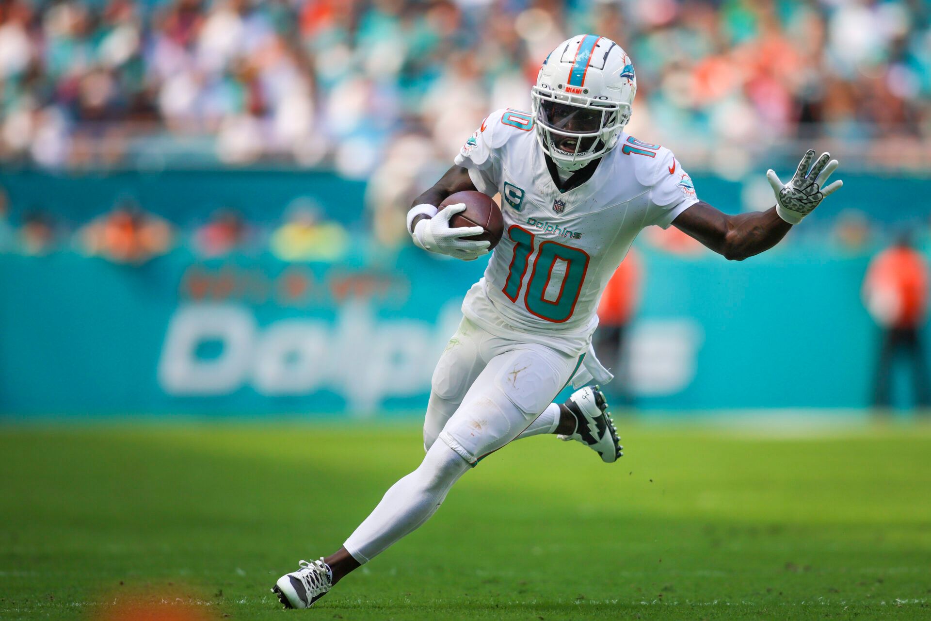 Miami Dolphins wide receiver Tyreek Hill (10) runs with the football against the Carolina Panthers during the second quarter at Hard Rock Stadium.