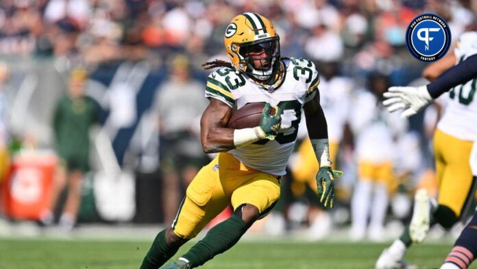 Green Bay Packers running back Aaron Jones (33) runs with the ball against the Chicago Bears at Soldier Field.