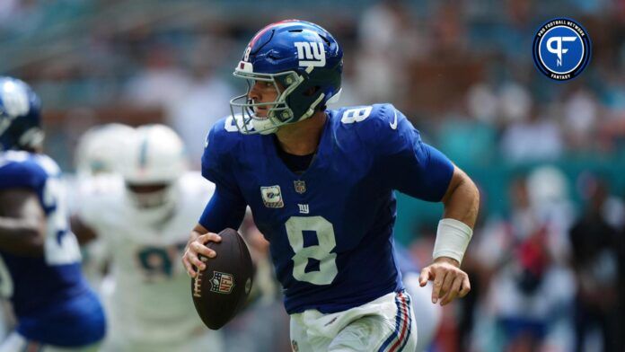 New York Giants quarterback Daniel Jones (8) scrambles with the ball agianst the Miami Dolphins during the first half at Hard Rock Stadium.