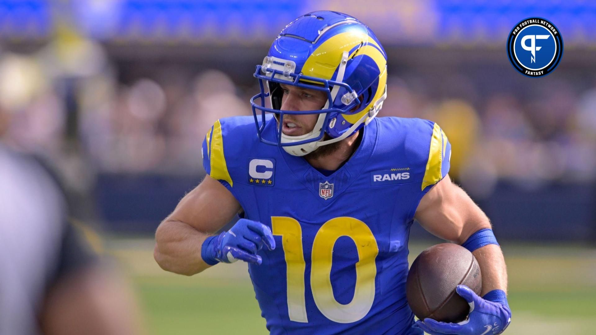 Los Angeles Rams wide receiver Cooper Kupp (10) runs after a catch against the Arizona Cardinals during the first half at SoFi Stadium.