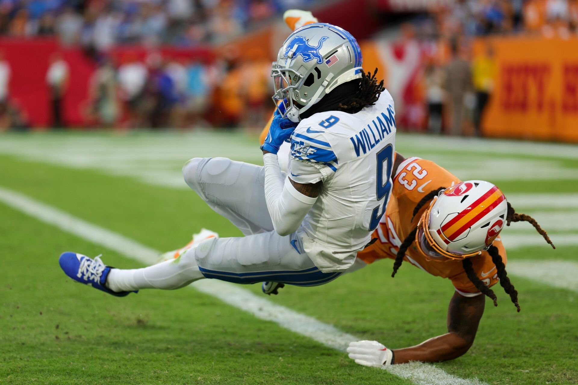 Detroit Lions WR Jameson Williams (9) catches a TD pass against the Tampa Bay Buccaneers.