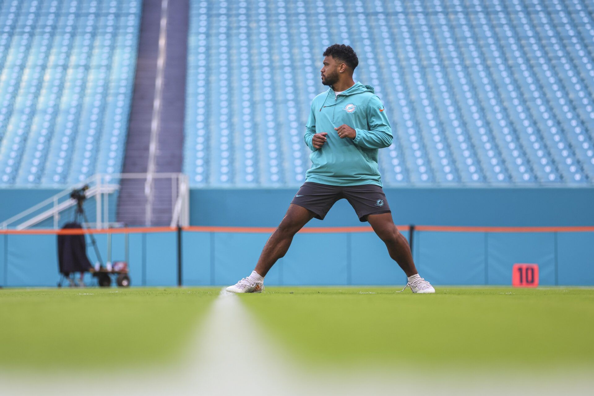 Miami Dolphins quarterback Tua Tagovailoa warms up prior to a game.