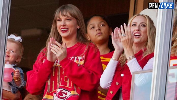 Taylor Swift and Brittany Mahomes cheer during the second half between the Los Angeles Chargers and the Kansas City Chiefs at GEHA Field at Arrowhead Stadium.