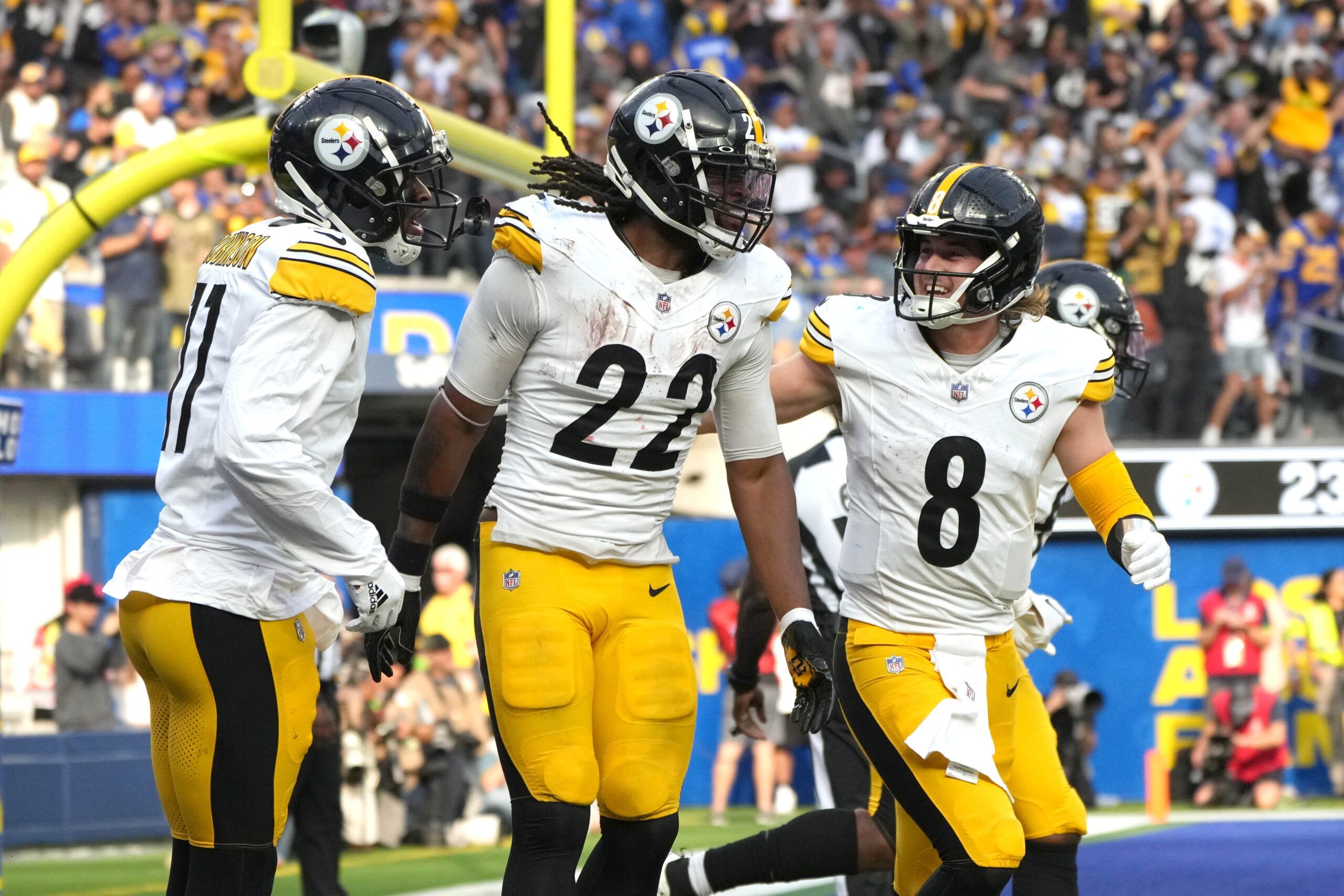 Najee Harris (22) celebrates with wide receiver Allen Robinson II (11) and quarterback Kenny Pickett (8) after scoring on a 3-yard touchdown run against the Los Angeles Rams in the second half at SoFi Stadium.