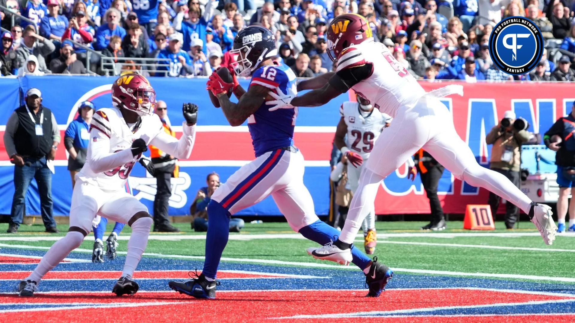 New York Giants TE Darren Waller (12) catches a touchdown pass against the Washington Commanders.