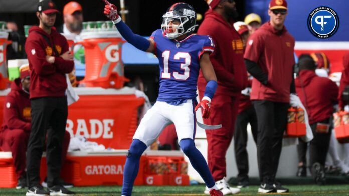 Jalin Hyatt (13) reacts after a first down catch during the first half against the Washington Commanders at MetLife Stadium.