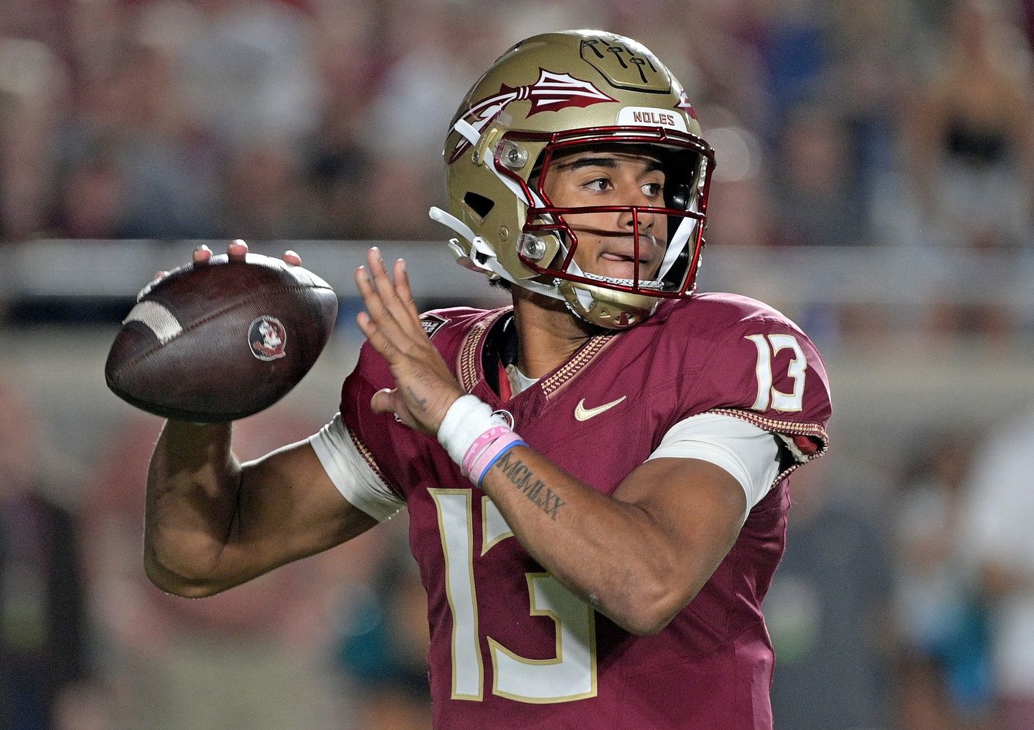 Jordan Travis (13) looks to throw during the first half against the Duke Blue Devils at Doak S. Campbell Stadium.