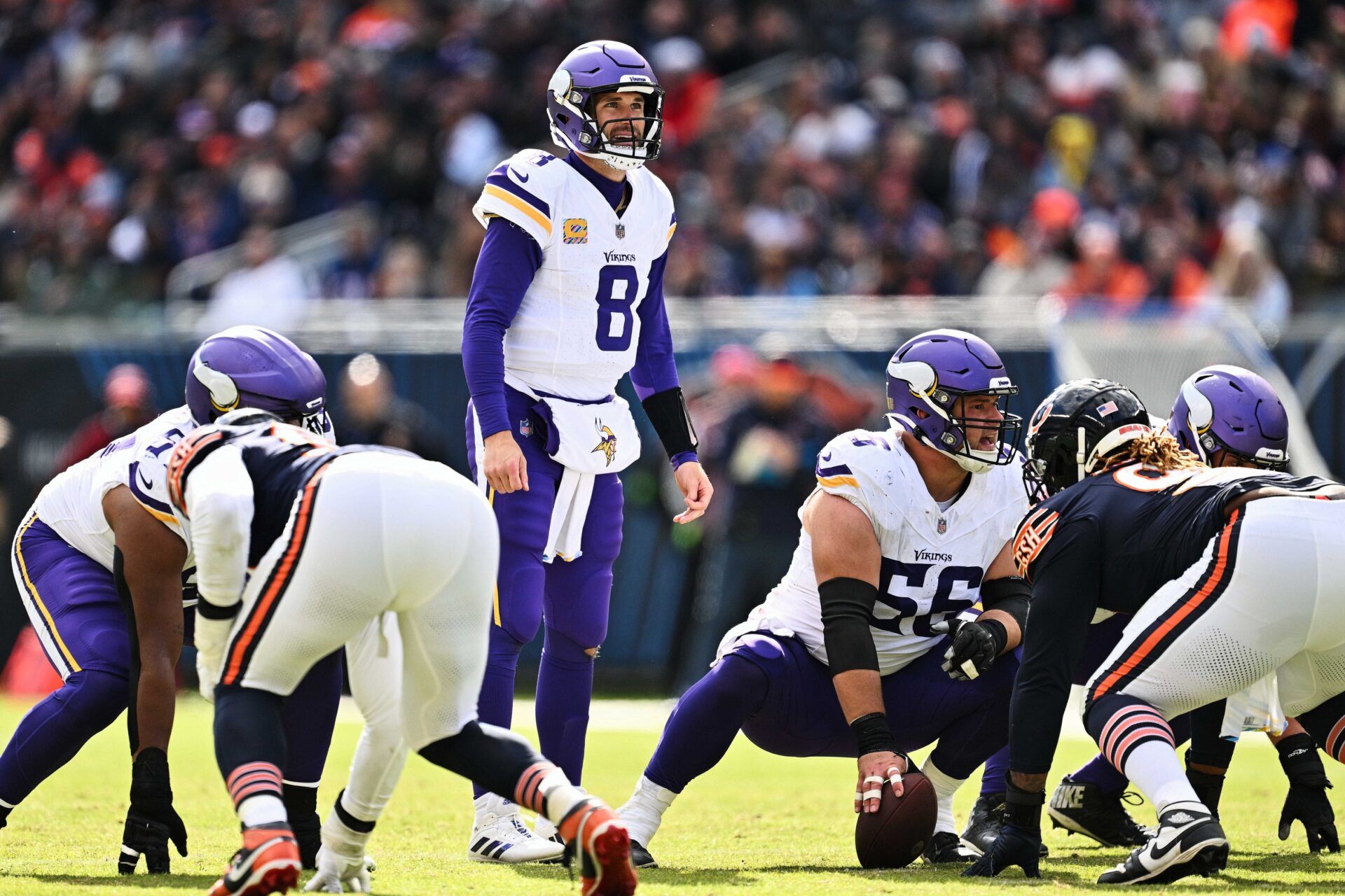 Minnesota Vikings QB Kirk Cousins (8) checks the defense before a play.