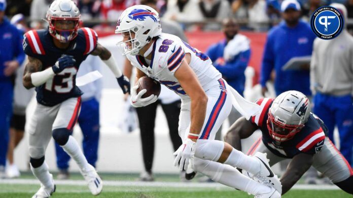 Dalton Kincaid (86) runs with the ball during the first half against the New England Patriots at Gillette Stadium.