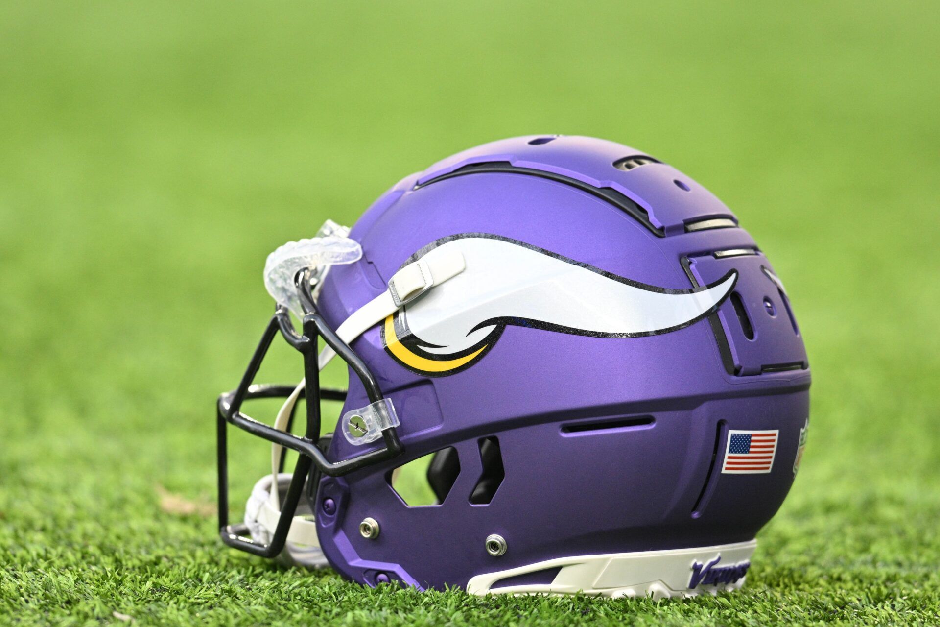 A Minnesota Vikings helmet sits on the turf before the game against the Tennessee Titans at U.S. Bank Stadium.